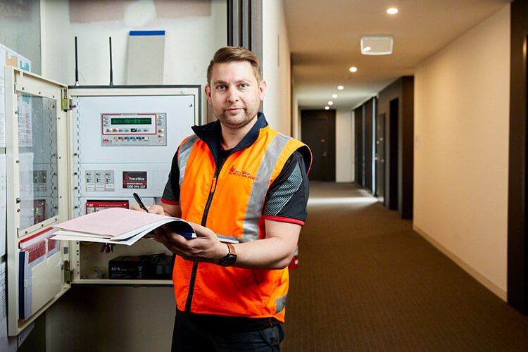 Fire and Wire fire protection staff working in a commercial building