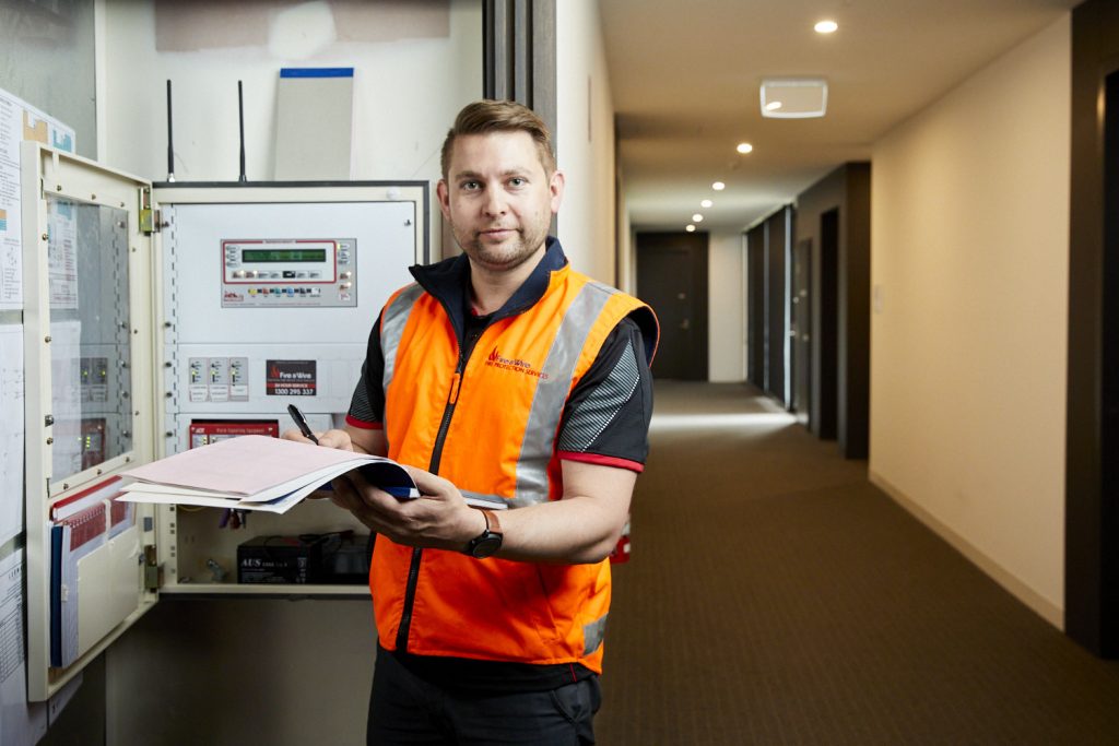 Fire and Wire fire protection staff working in a commercial building