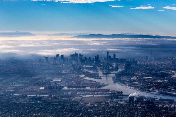 A birds-eye view of the Melbourne CBD, with cloudy fog overhead