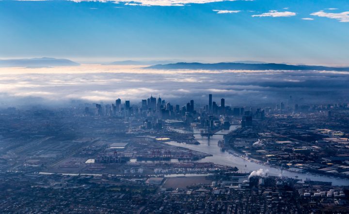 A birds-eye view of the Melbourne CBD, with cloudy fog overhead