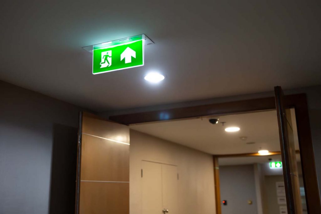 Fire exit in building. Fire safety installation.